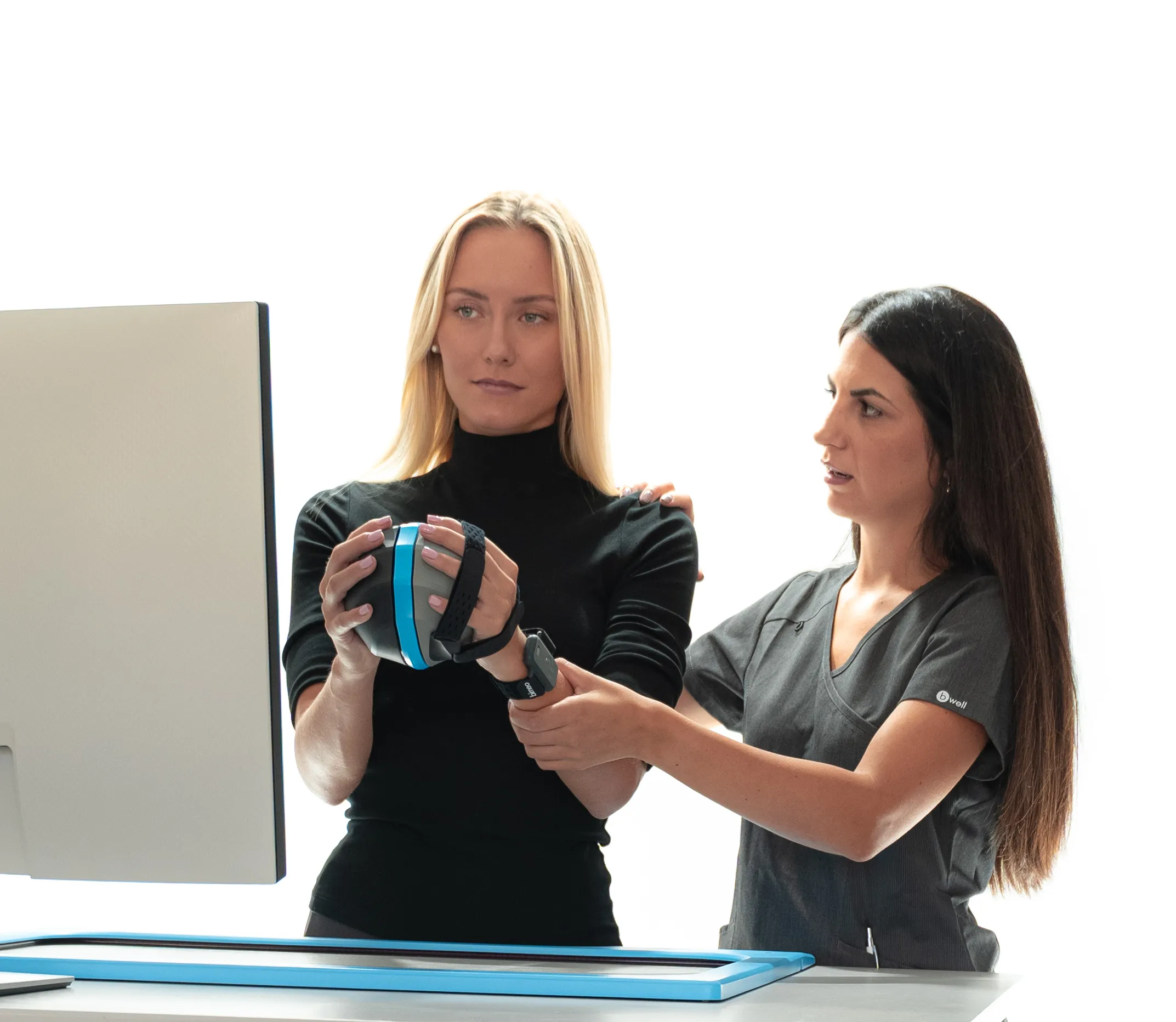 A therapist heplping a patient with Bimeo.